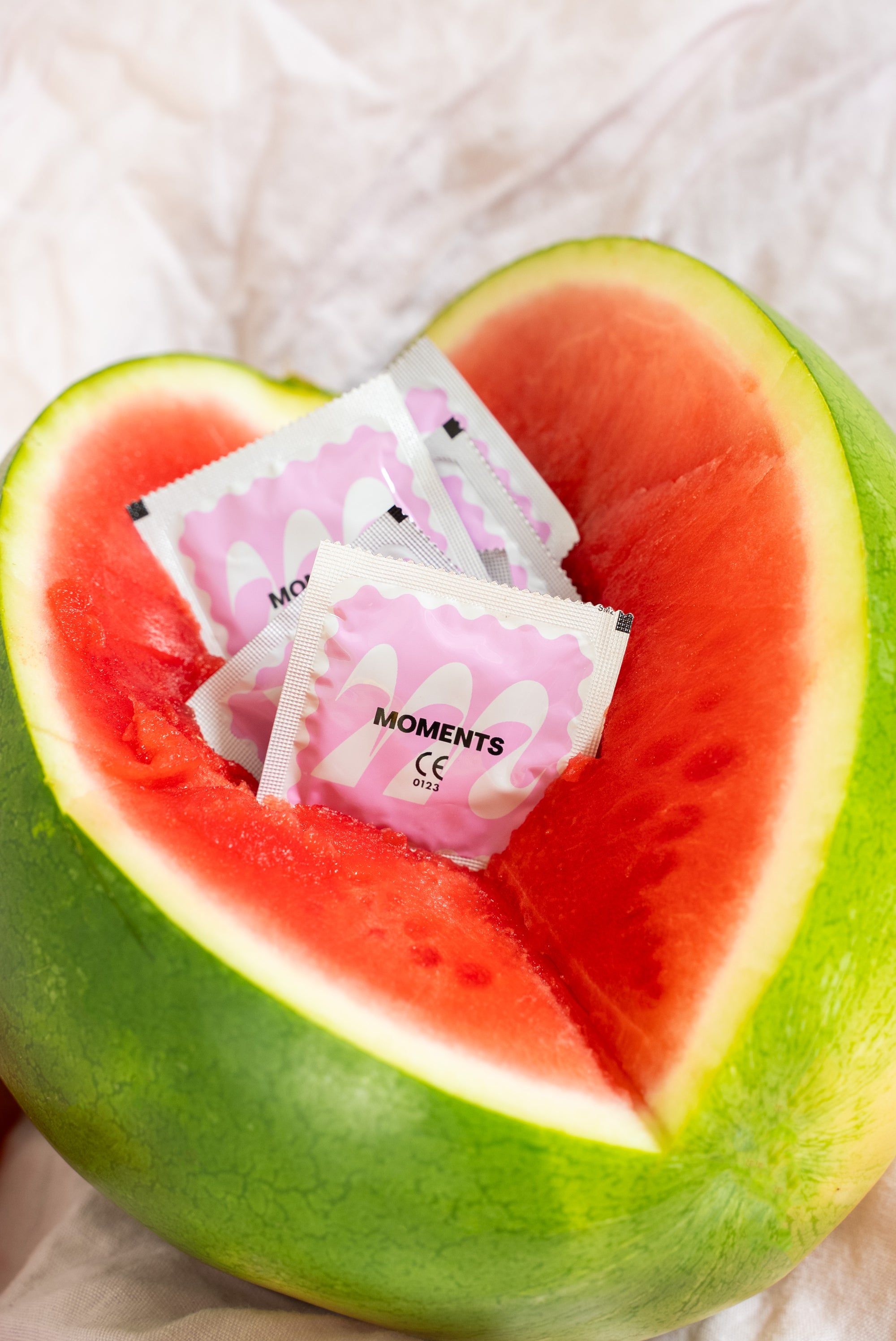 Close-up of Moments Watermelon flavoured condoms