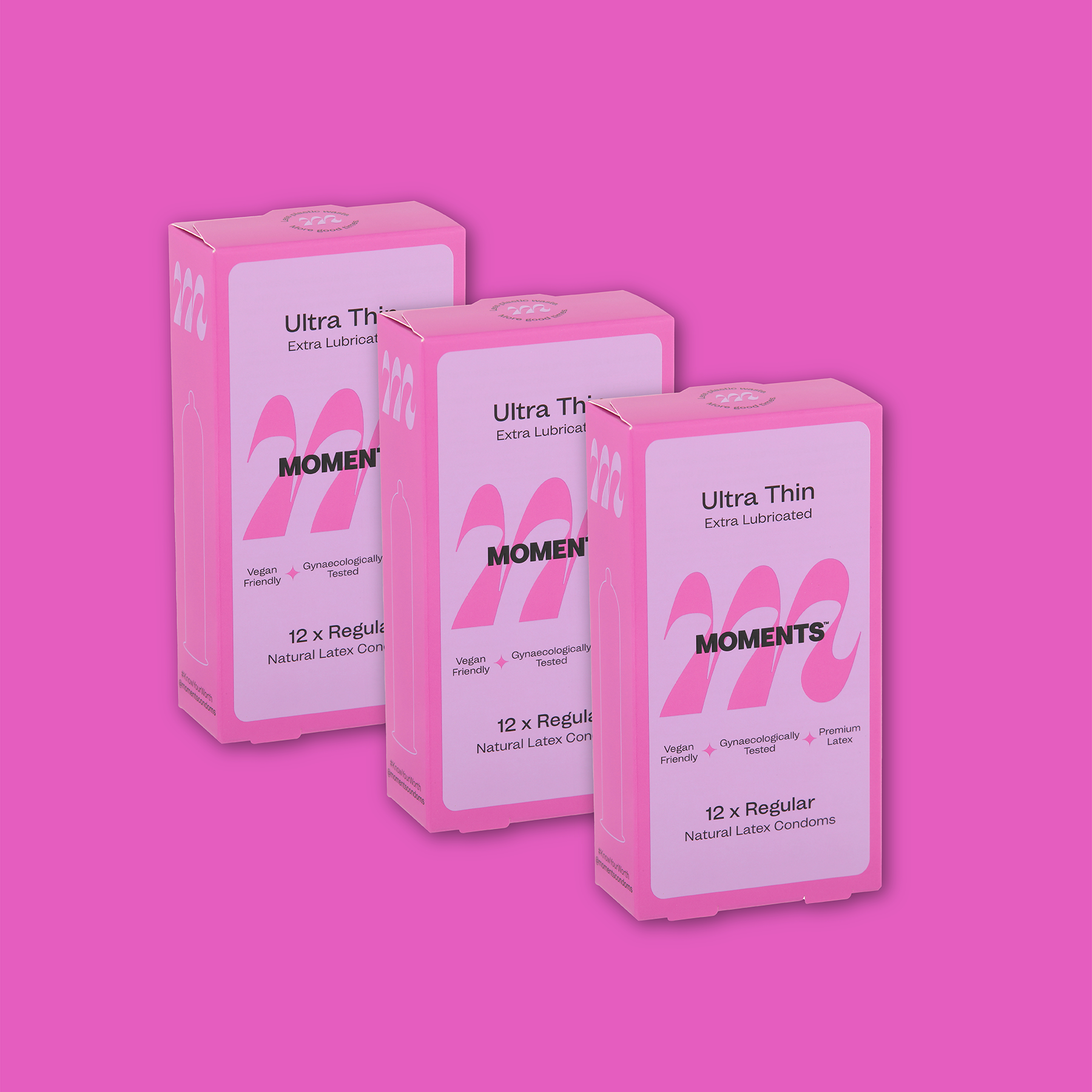 Moments Ultra Thin Regular condom pack displayed against a pink backdrop